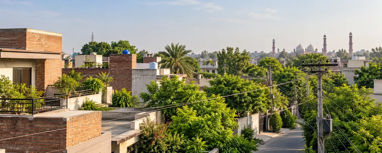 AI-generated illustrative residential scene inspired by Lahore, with rooftops and electricity infrastructure